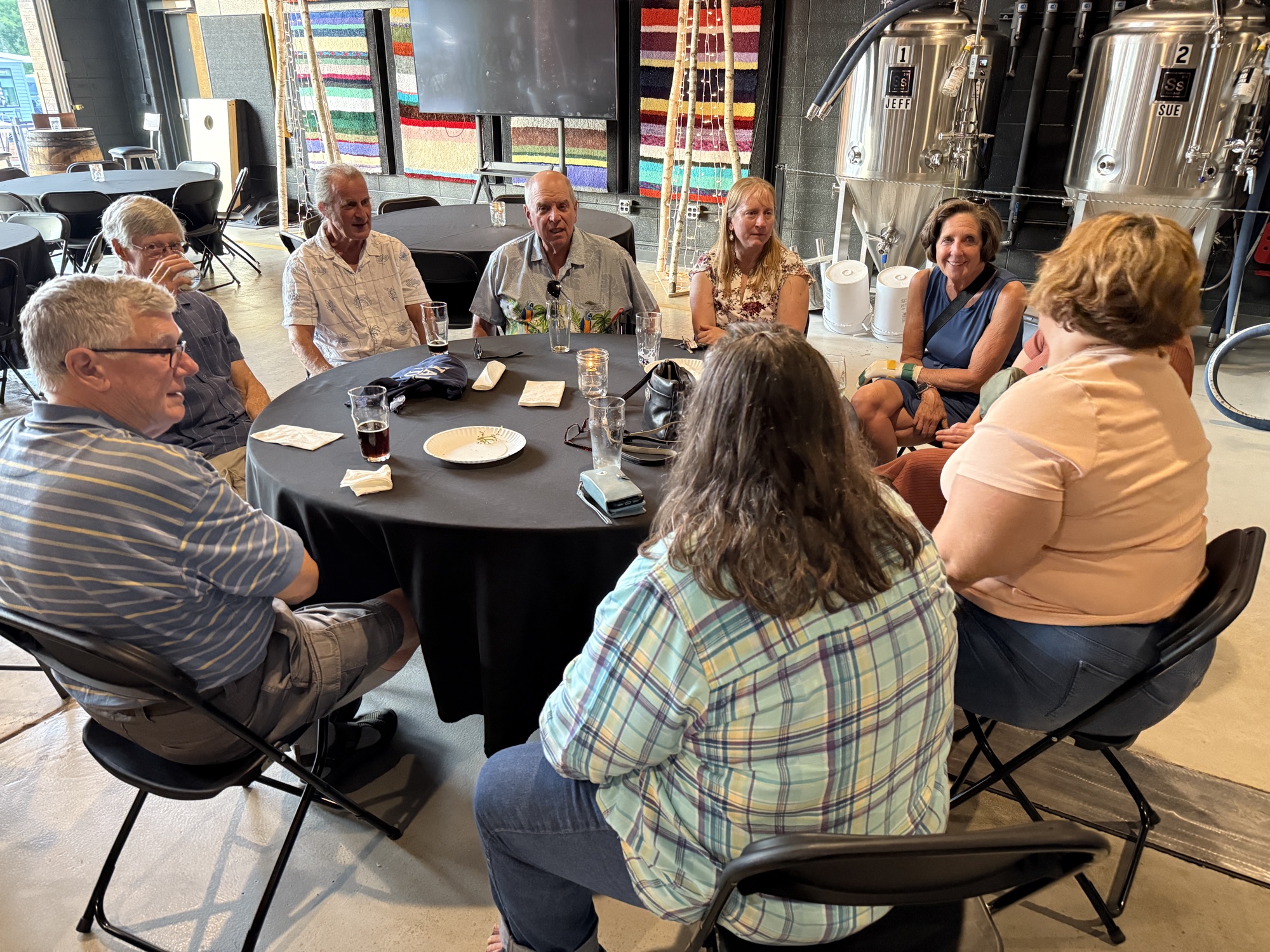 A group gathered around a table during a Hands On Deck gathering