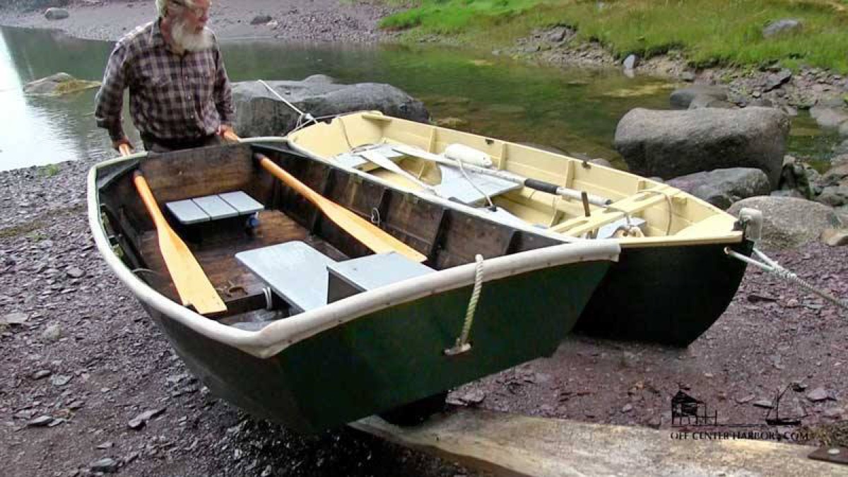 Wheelbarrow boat with wooden seats and oars