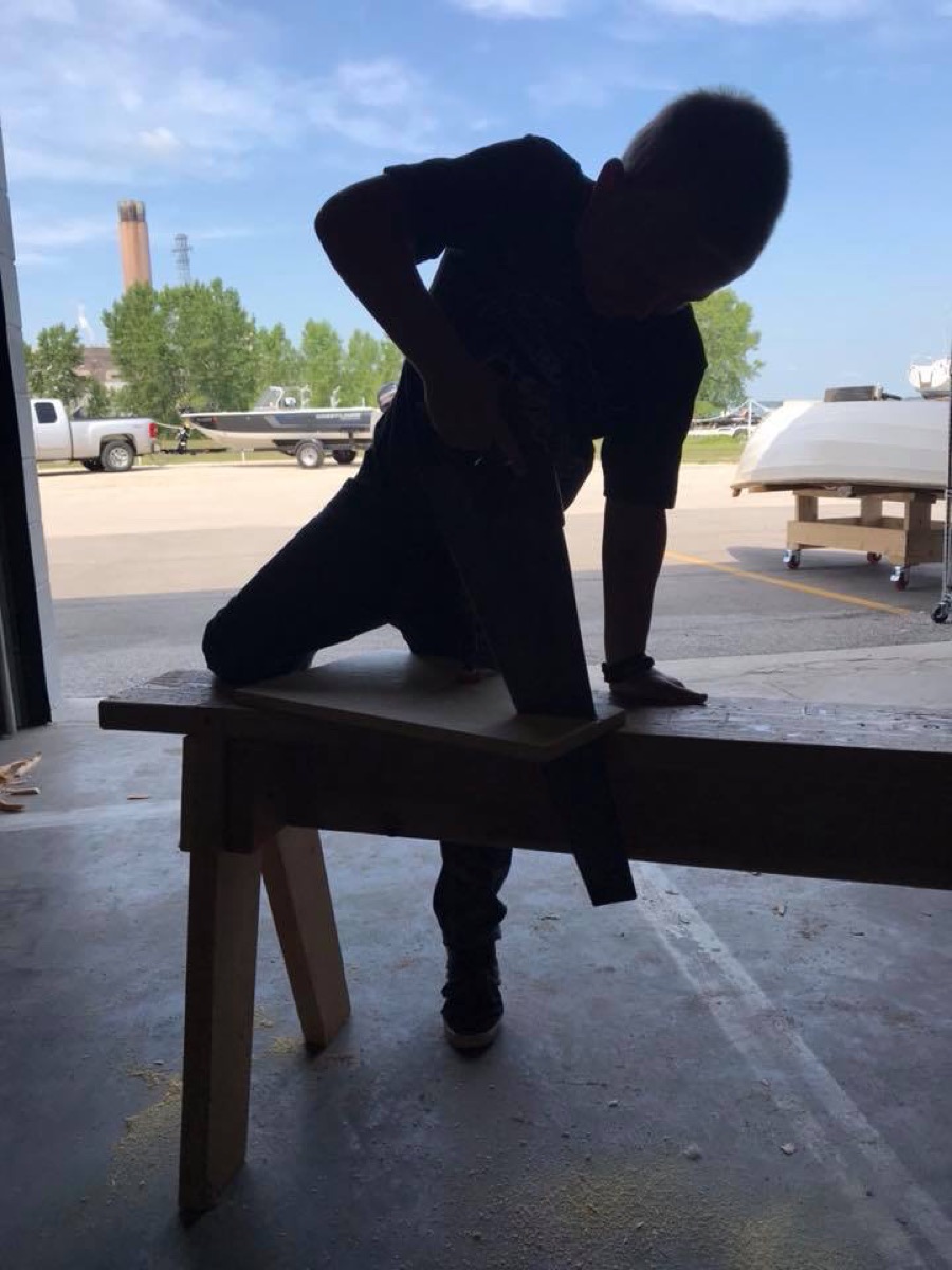 Child using a woodworking bench