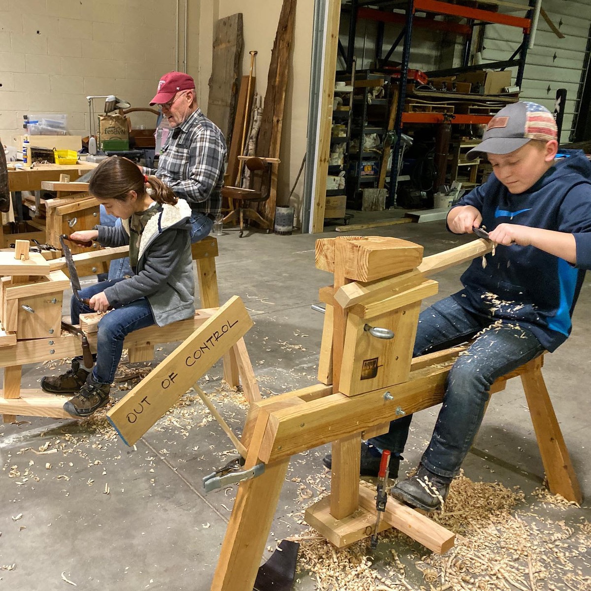 Woodworkers using shave horses