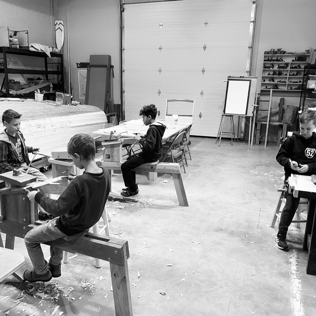 Students seated at workshop benches