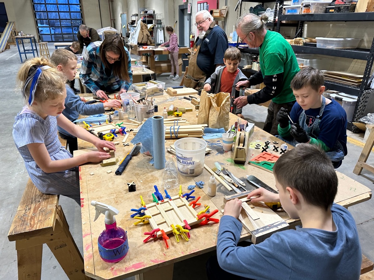 Children building colorful wooden projects