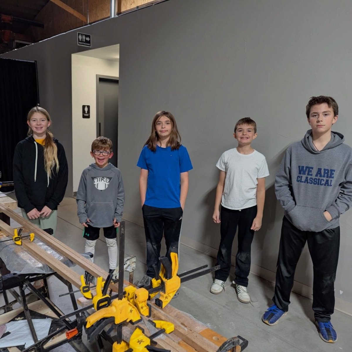 Students displaying woodworking projects