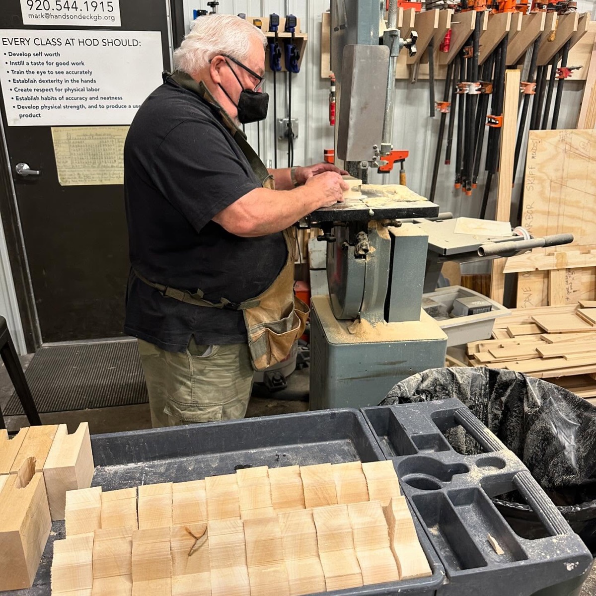 Woodworker using a bandsaw