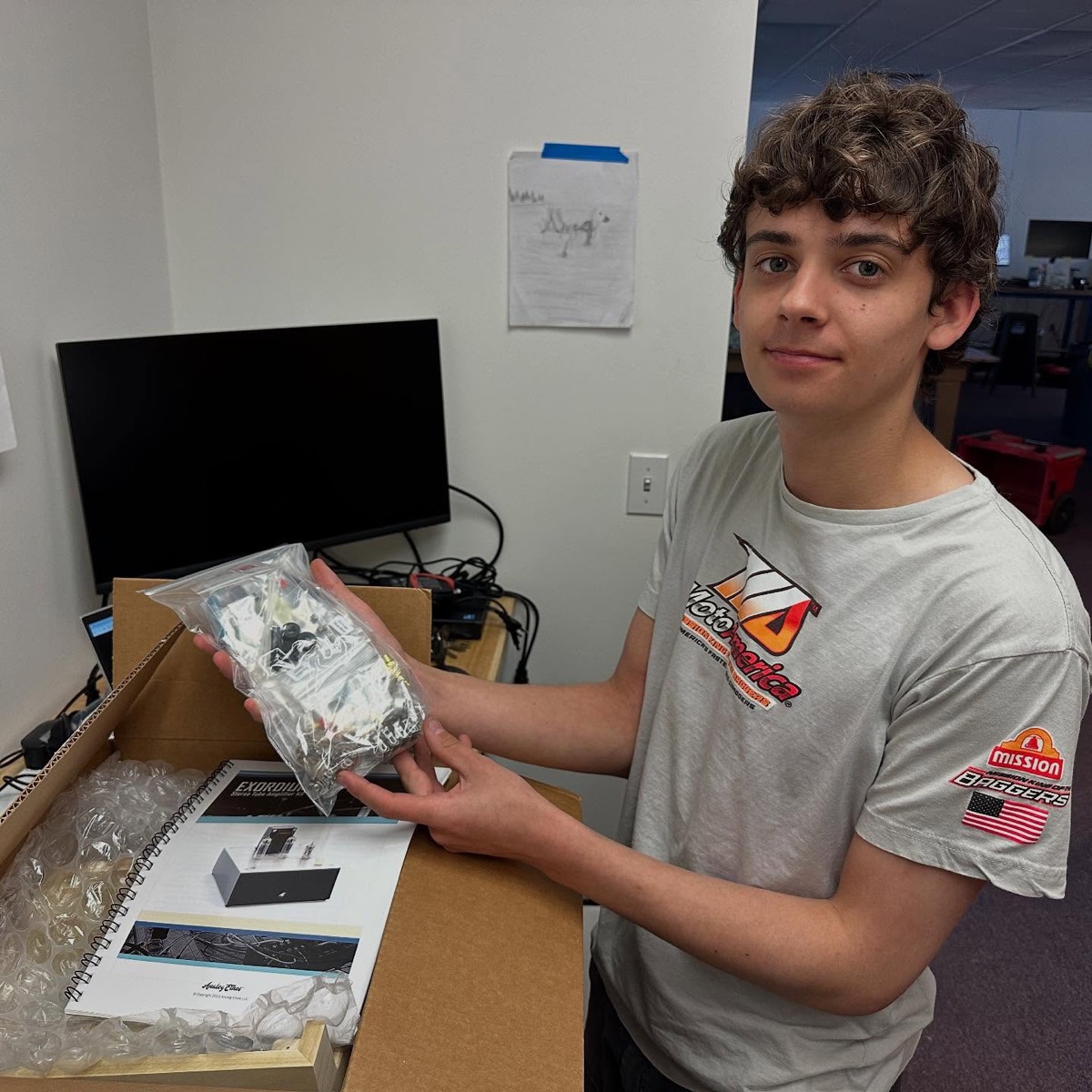 Student holding a workshop project