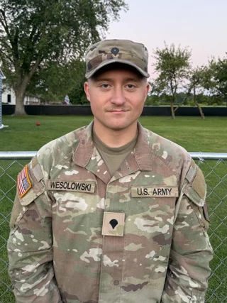 Portrait of a young man in U.S. Army uniform outdoors